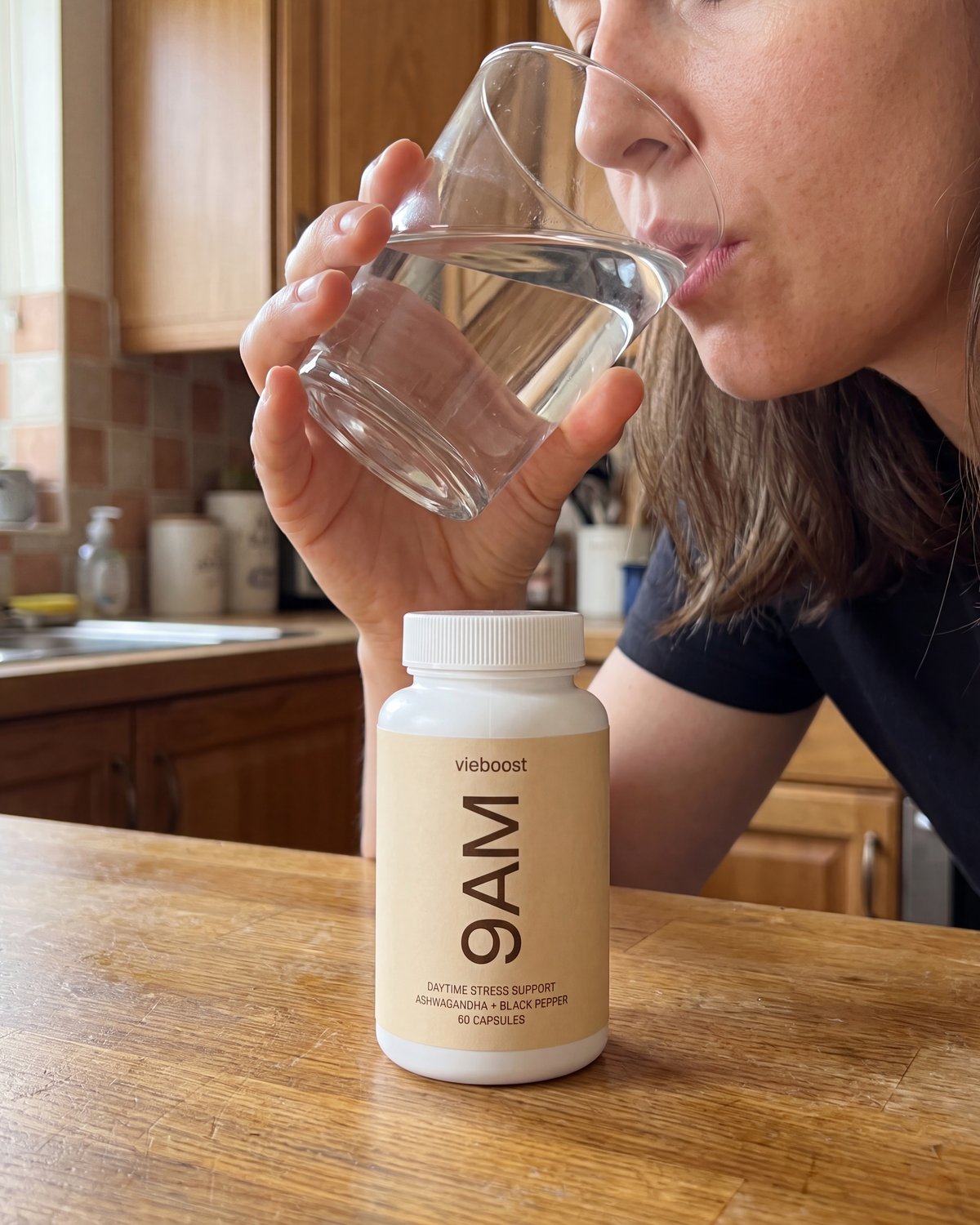 9AM™ bottle — organic ashwagandha root capsules on a morning desk