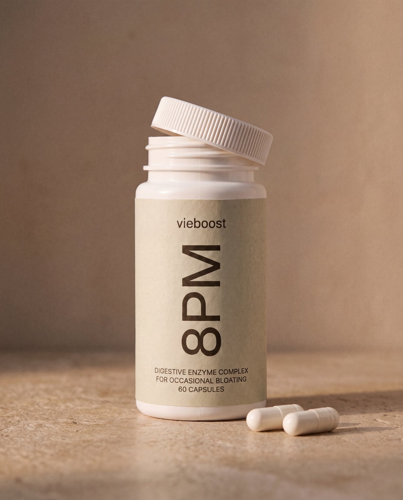 8PM™ ingredient still life — bottle and digestive enzyme capsules