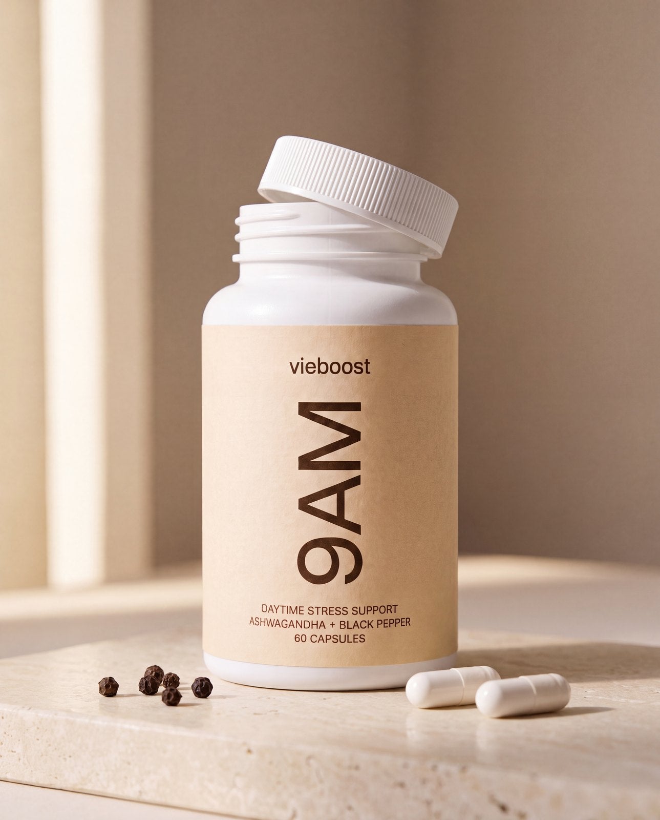 9AM™ ingredient still life — bottle, capsules and black pepper